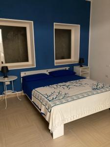A bed or beds in a room at Villetta Ottaviano