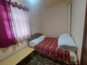 Voodi või voodid majutusasutuse RAHAT Guest House & Hostel in Toktogul toas