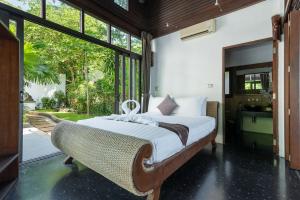 Postel nebo postele na pokoji v ubytování Beach Front Villa + 37 fotografií
