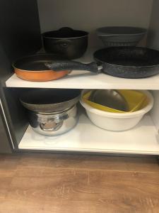 a shelf with various bowls and pans on it at Nilin in Istanbul