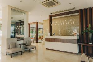 a lobby of a restaurant with chairs and a counter at Ayala Mall 10mins walk Cebu City Apartment & Pool in Cebu City