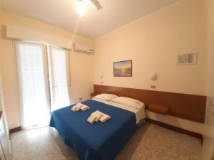 Postel nebo postele na pokoji v ubytování Hotel Amalfi + 37 fotografií