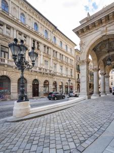 a street in front of a large building with a street light at Opera Luxury Apartment in Budapest