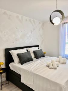 Postel nebo postele na pokoji v ubytování Apartmani CUBE L