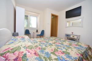 Postel nebo postele na pokoji v ubytování Apartment Plazza Rafailovici