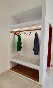 a walk in closet with hangers at Sea Harmony in Kalathos