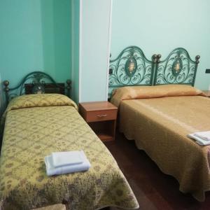 A bed or beds in a room at Hotel Grazia Ristorante