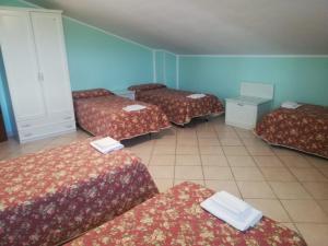 A bed or beds in a room at Hotel Grazia Ristorante