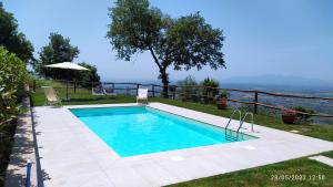 a swimming pool with a view of the ocean at Podere Calistri in Larciano