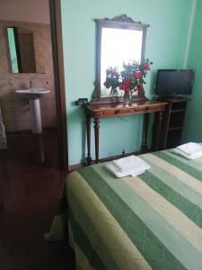 A bed or beds in a room at Hotel Grazia Ristorante