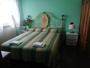 A bed or beds in a room at Hotel Grazia Ristorante