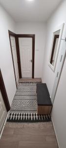an empty stairway with a door and a door at Birchwood place in Sarajevo