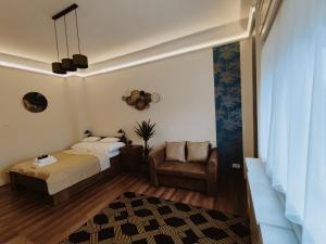 Ένα ή περισσότερα κρεβάτια σε δωμάτιο στο Central Palace Apartman