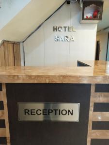 a sign for a hotel saara on a counter at Hotel Sara PVT LTD in Janakpur