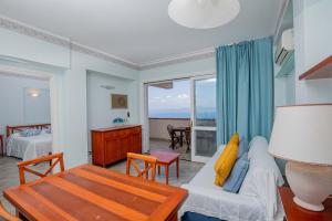 a living room with a couch and a table at Residence Sole Dell'Argentario in Porto Santo Stefano +273 photos