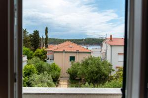 a view from a window of a house at Rab Apartment LUCE in Barbat na Rabu