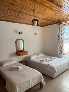 Кровать или кровати в номере Cirali Irmak Hotel