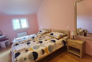 a bedroom with a bed and a large mirror at Apartment Luce in Pićan +23 photos
