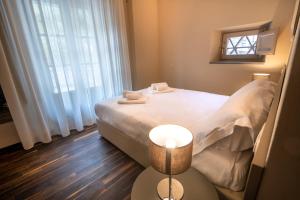 A bed or beds in a room at Il Pradicciolo Agriturismo