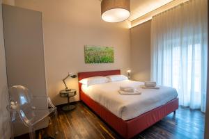 A bed or beds in a room at Il Pradicciolo Agriturismo