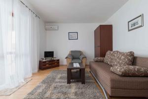 a living room with a couch and a table at Apartment in Porec/Istrien 10190 in Poreč