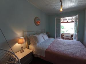 A bed or beds in a room at Sweet Maisonette in Corfu Town