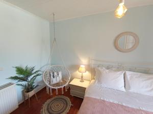 A bed or beds in a room at Sweet Maisonette in Corfu Town