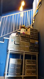 a stair case with drawers and a stair railing at Mon P'tit Hôtel in Le Grau-dʼAgde