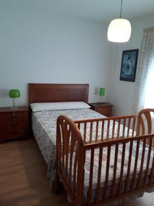 A bed or beds in a room at Cantos do Coido