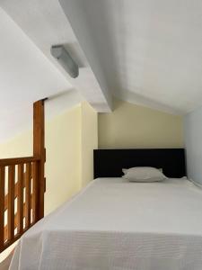 Ліжко або ліжка в номері La casa di Alexandros