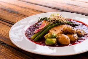 a plate of food with vegetables on a table at Hotel Cala Blanca Cuernavaca in Cuernavaca
