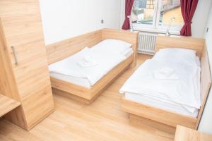 Postel nebo postele na pokoji v ubytování Hotel Fulda