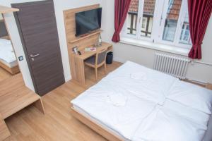 Postel nebo postele na pokoji v ubytování Hotel Fulda