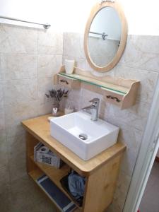 a bathroom with a sink and a mirror at Melissou place in Apollonia