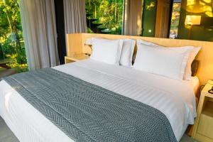 Postel nebo postele na pokoji v ubytování Hotel Toriba