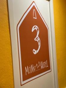 a stop sign with a number three on it at Mon P'tit Hôtel in Le Grau-dʼAgde
