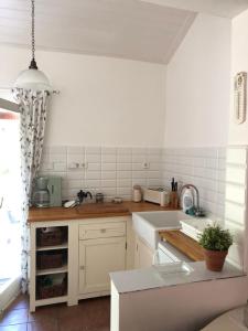 Køkken eller tekøkken på Hortenzia Apartman