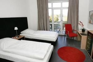 Postel nebo postele na pokoji v ubytování Hotel am Hof