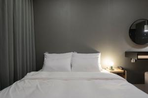 Postel nebo postele na pokoji v ubytování Object AanK Hotel Gumi