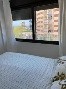 Łóżko lub łóżka w pokoju w obiekcie Apartamento Ca Batallera Playa Gandia