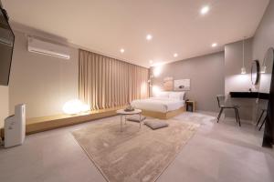Postel nebo postele na pokoji v ubytování Object AanK Hotel Gumi