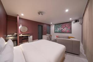 Postel nebo postele na pokoji v ubytování Object AanK Hotel Gumi