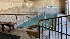 a swimming pool with a stairway leading to a swimming pool at Spinnaker at Lake Dillon in Dillon