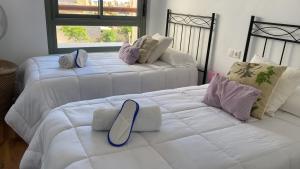 En eller flere senger på et rom på Apartamento Cabo de Gata-Toyo