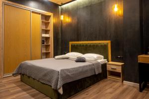 Säng eller sängar i ett rum på Готельно-ресторанний комплекс Каскад