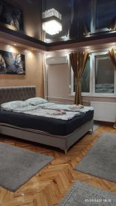 Voodi või voodid majutusasutuse Iva Lux apartman toas