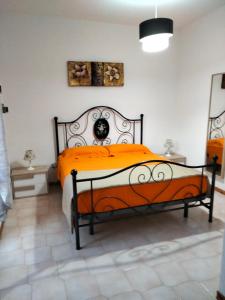 Villetta Clorinda tesisinde bir odada yatak veya yataklar