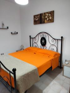 Villetta Clorinda tesisinde bir odada yatak veya yataklar