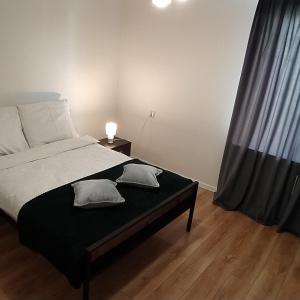 Cama o camas de una habitación en Apartament Aksamitny
