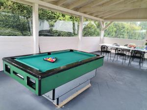 a pool table in a covered patio at Cicha Dolina in Ustka